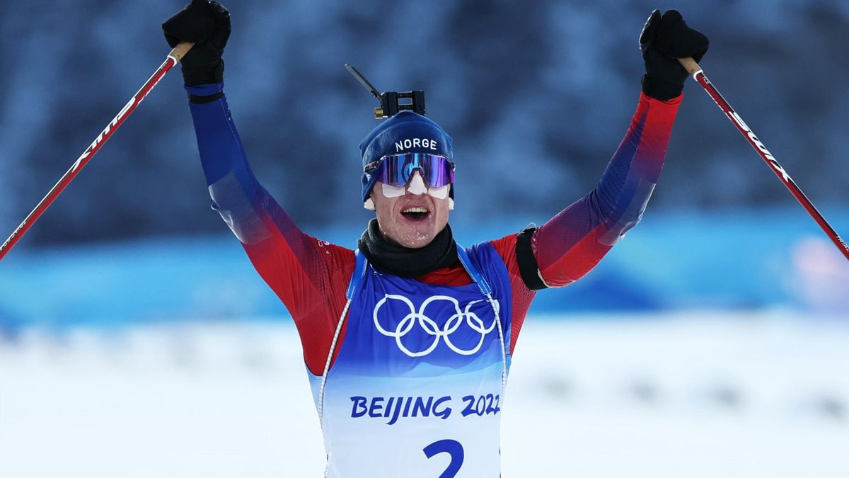 Johannes Thingnes Boe of Team Norway celebrates after winning gold during Men's Biathlon 15km Mass Start