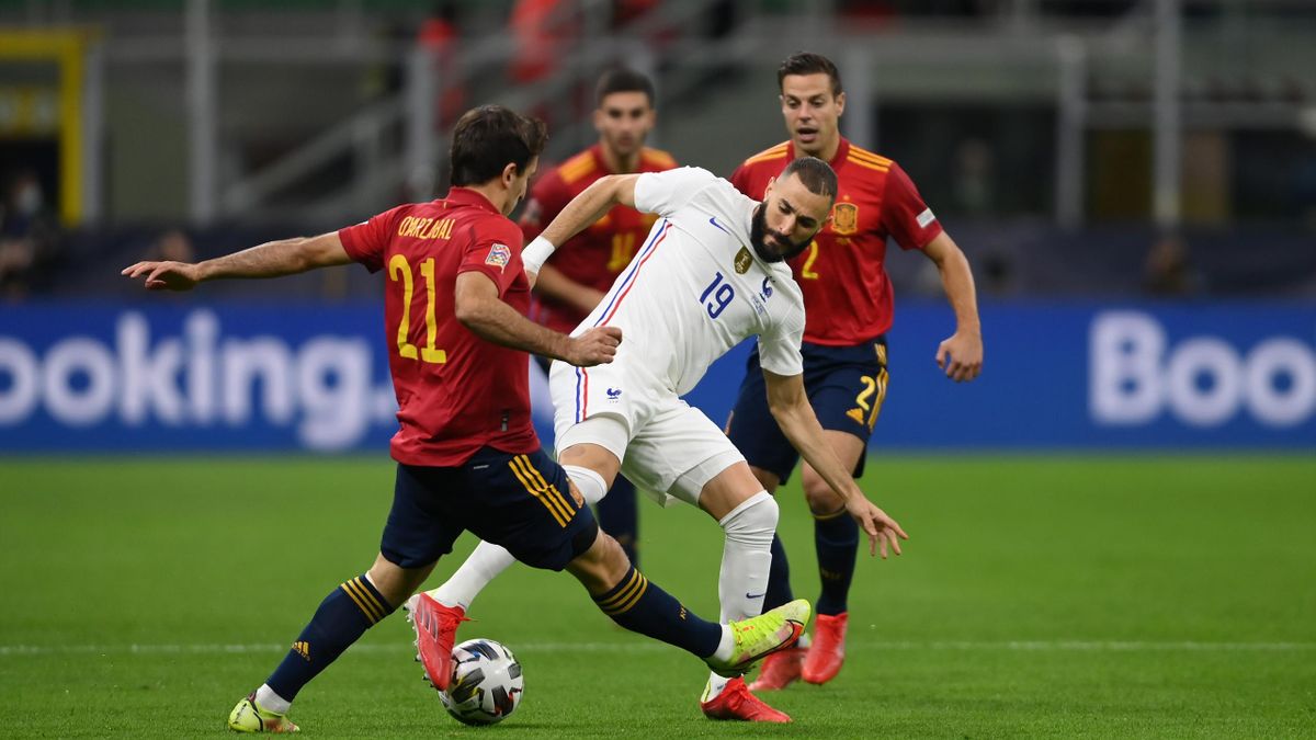 Karim Benzema of France battles for possession with Mikel Oyarzabal of Spain during the UEFA Nations League 2021 Final match between Spain and France at San Siro Stadium on October 10, 2021 in Milan, Italy.