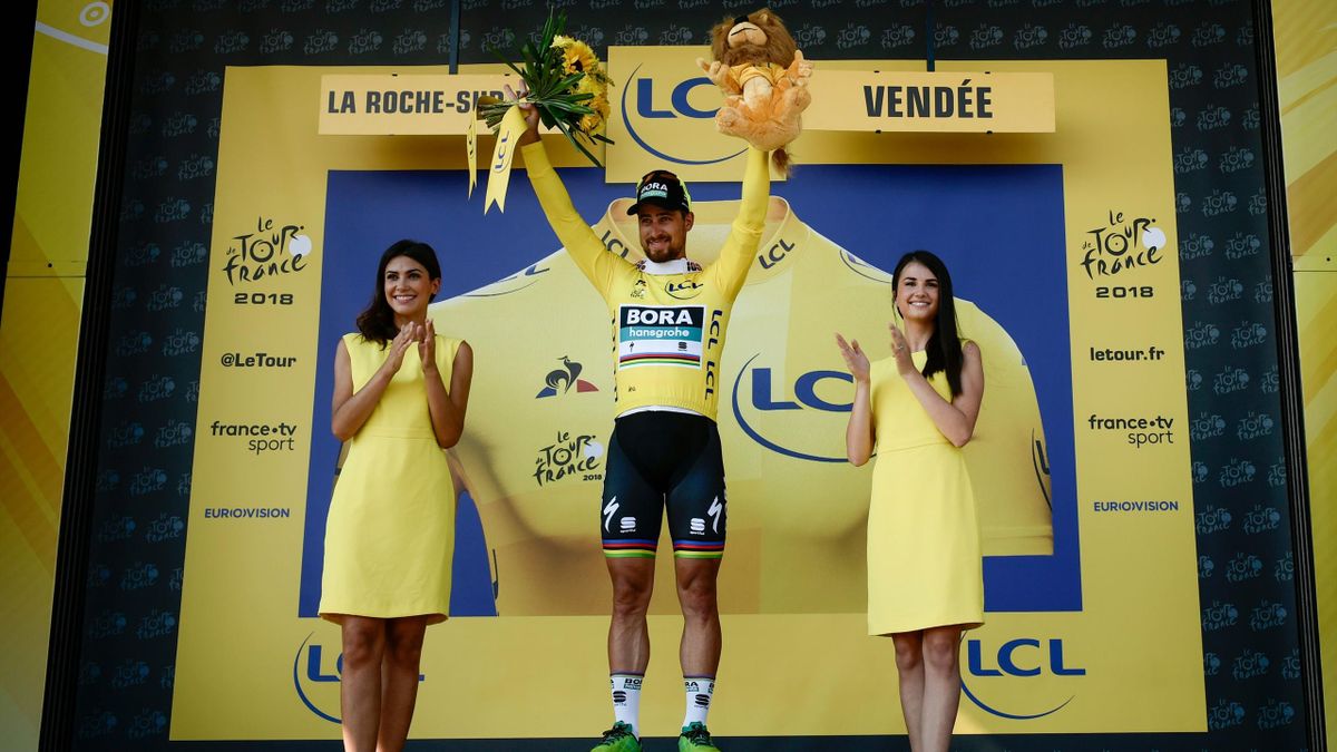 Slovakia's Peter Sagan, wearing the overall leader's yellow jersey, celebrates on the podium after winning the second stage of the 105th edition of the Tour de France cycling race between Mouilleron-Saint-Germain and La Roche-sur-Yon, western France, on J