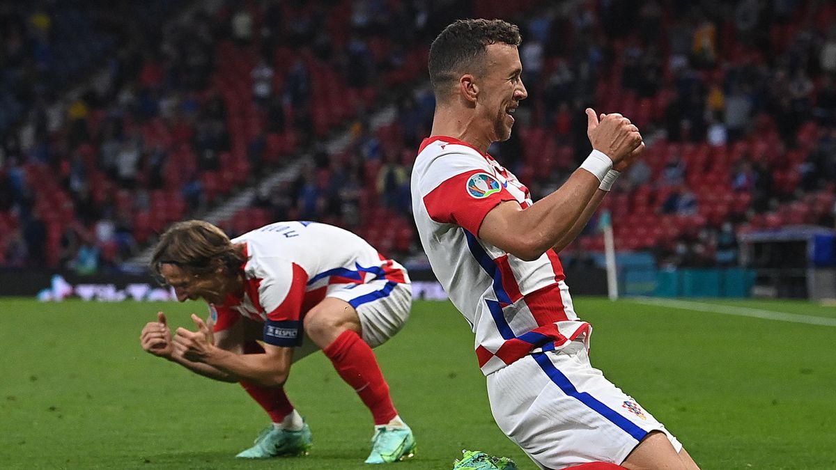 TOPSHOT - Croatia's forward Ivan Perisic (R) celebrates after scoring the third goal during the UEFA EURO 2020 Group D football match between Croatia and Scotland at Hampden Park in Glasgow on June 22, 2021