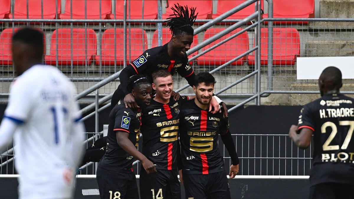 tade Rennais French midfielder Benjamin Bourigeaud (C) is congratulated by teammates after scoring a goal during the French L1 football match between Stade Rennais and Strasbourg, at the Roazhon Park stadium in Rennes, northwestern France, on March 14, 20