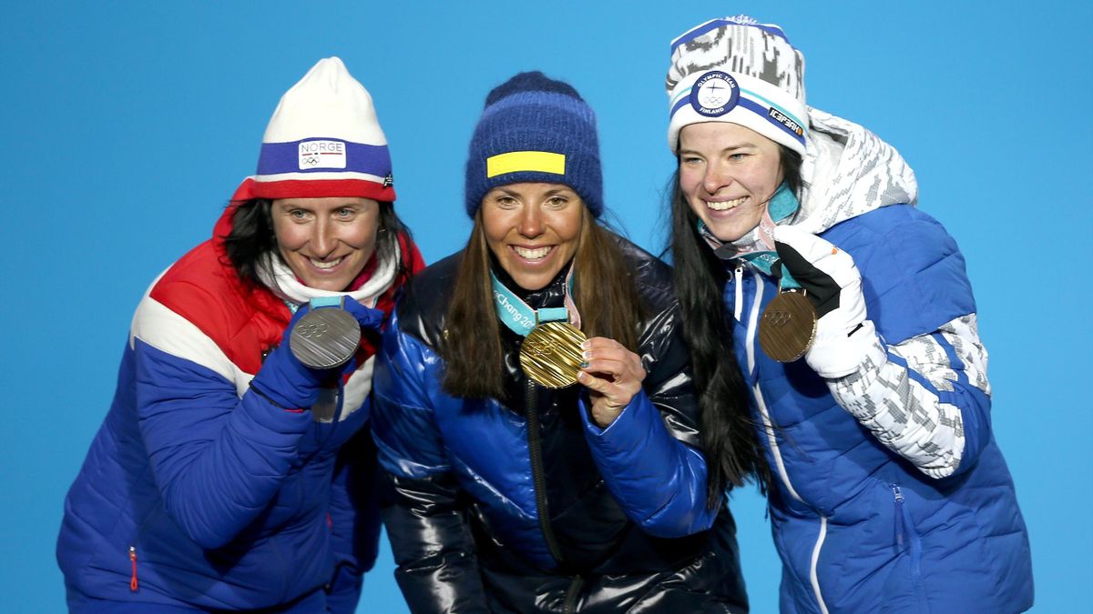 Silver medalist Marit Bjoergen of Norway, gold medalist Charlotte Kalla of Sweden and bronze medalist Krista Parmakoski of Finland pose during the Medal Ceremony for the Cross-Country Skiing Ladies' 7.5km + 7.5km Skiathlon