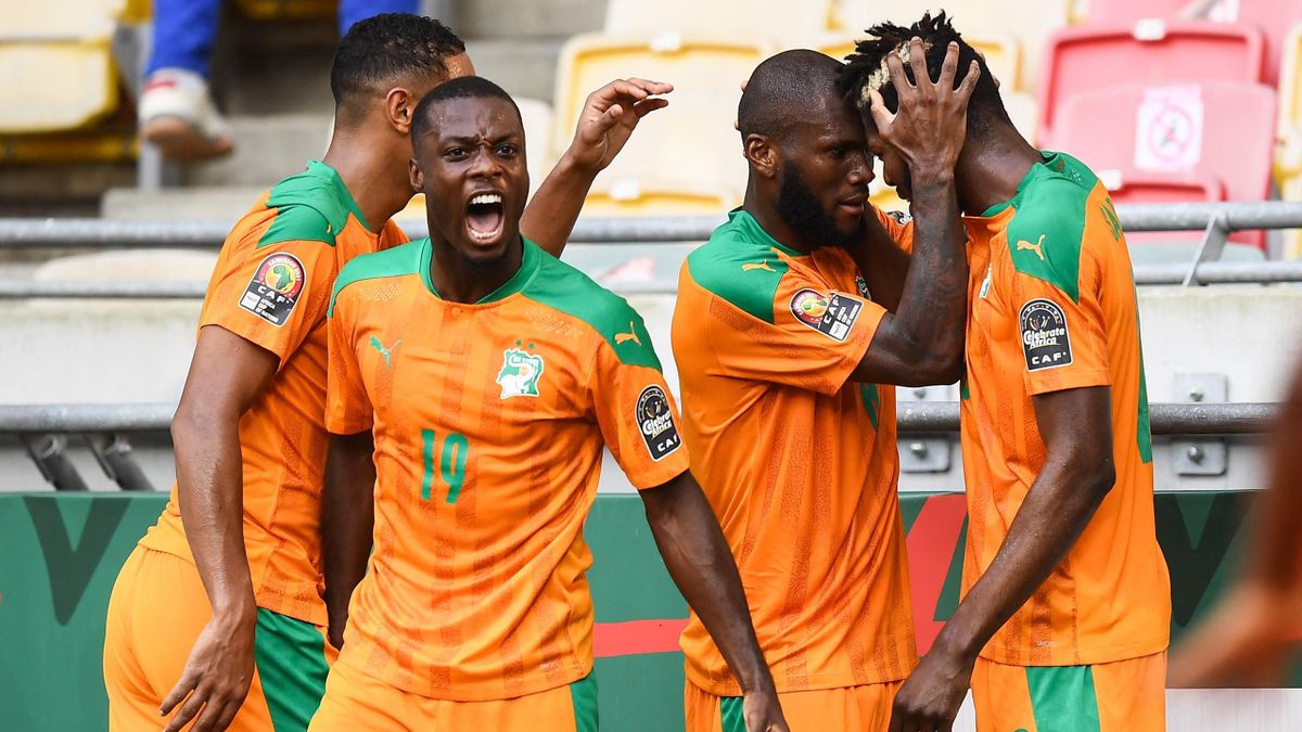 Ivory Coast's midfielder Franck Kessie (2nd R) celebrates with Ivory Coast's midfielder Ibrahim Sangare (R) and Ivory Coast's forward Nicolas Pepe (2nd L) after scoring his team's first goal during the Group E Africa Cup of Nations