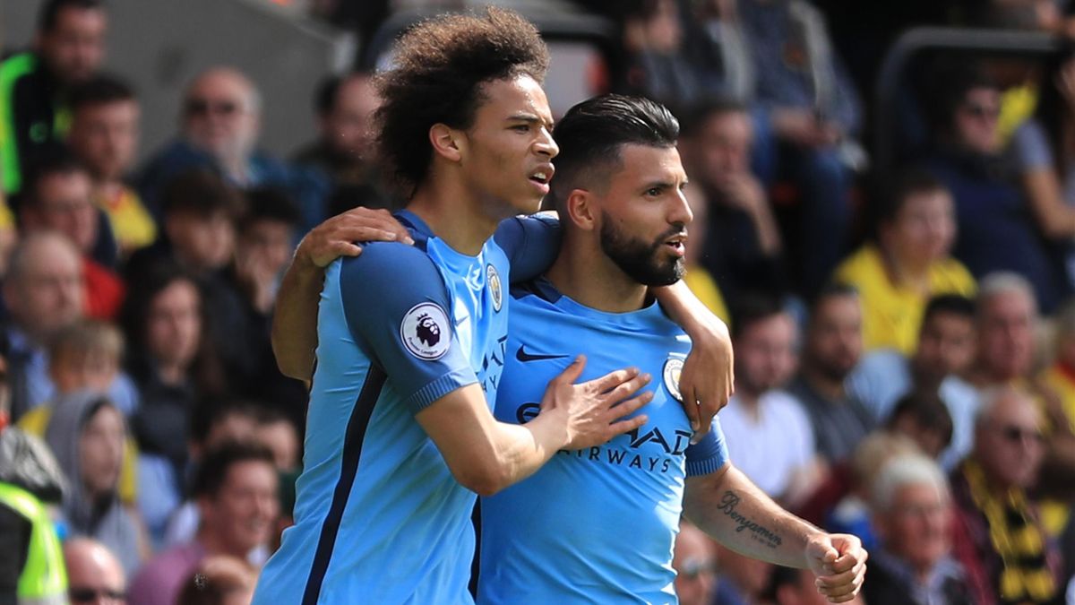 Sergio Aguero of Manchester City celebrates scoring his sides third goal with Leroy Sane of Manchester City during the Premier League match between Watford and Manchester City at Vicarage Road on May 21, 2017 in Watford, England.
