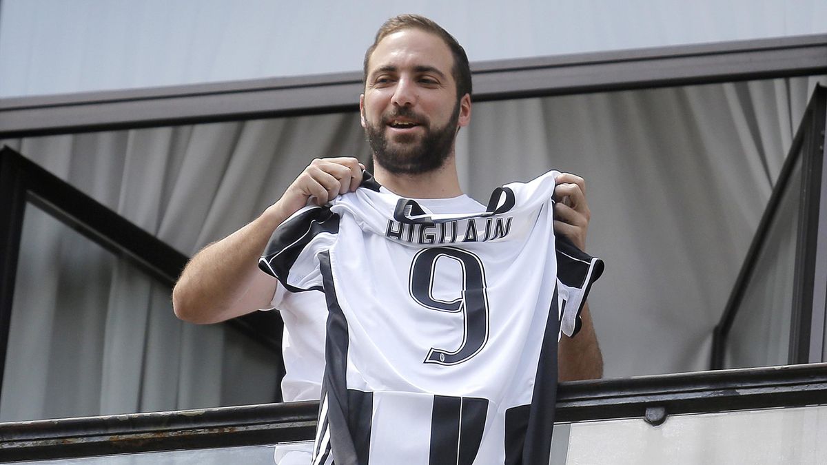 Juventus' forward Gonzalo Higuain from Argentina holds his jersey