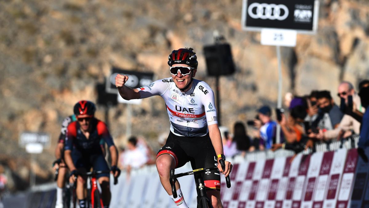 adej Pogacar of Slovenia and UAE Team Emirates white best young jersey celebrates winning ahead of Adam Yates of United Kingdom and Team INEOS Grenadiers during the 4th UAE Tour 2022 - Stage 4 a 181km stage from Fujairah Fort to Jebel Jais 1490m / #UAETou
