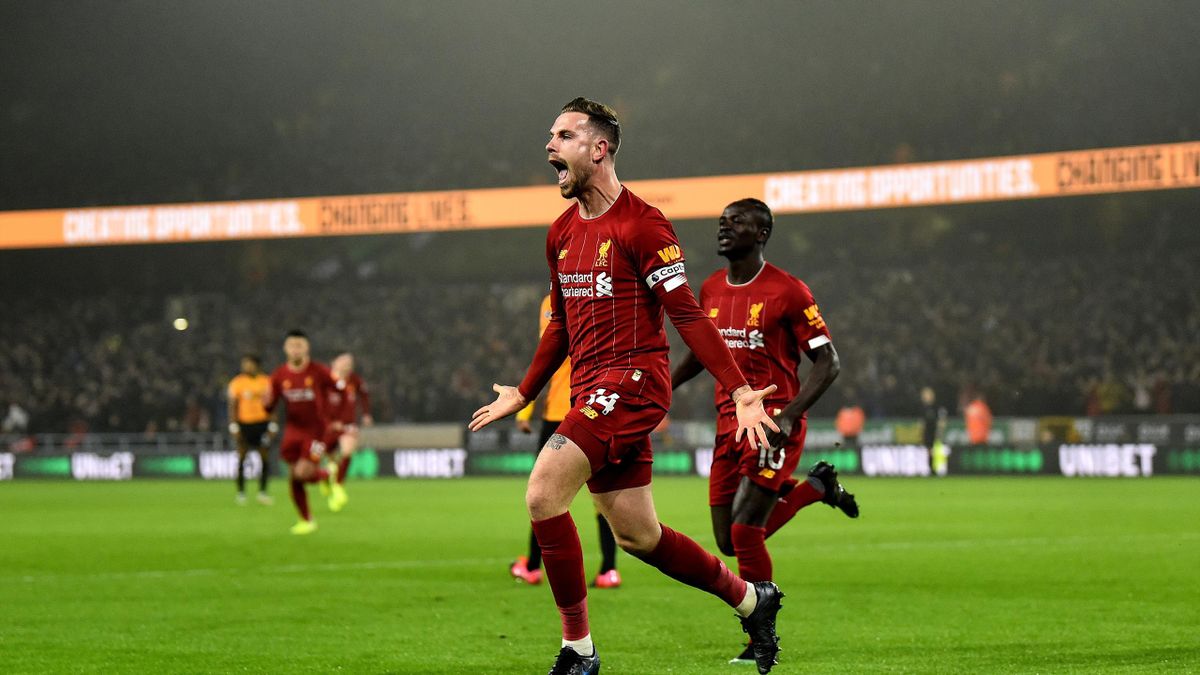 Jordan Henderson captain of Liverpool celebrates after scoring the opening goal during the Premier League match between Wolverhampton Wanderers and Liverpool FC at Molineux on January 23, 2020 in Wolverhampton, United Kingdom
