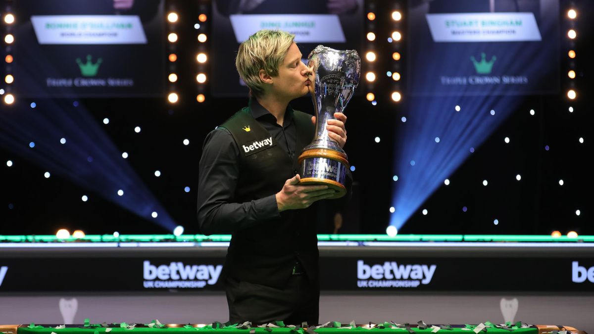 Neil Robertson celebrates with the UK Championship trophy