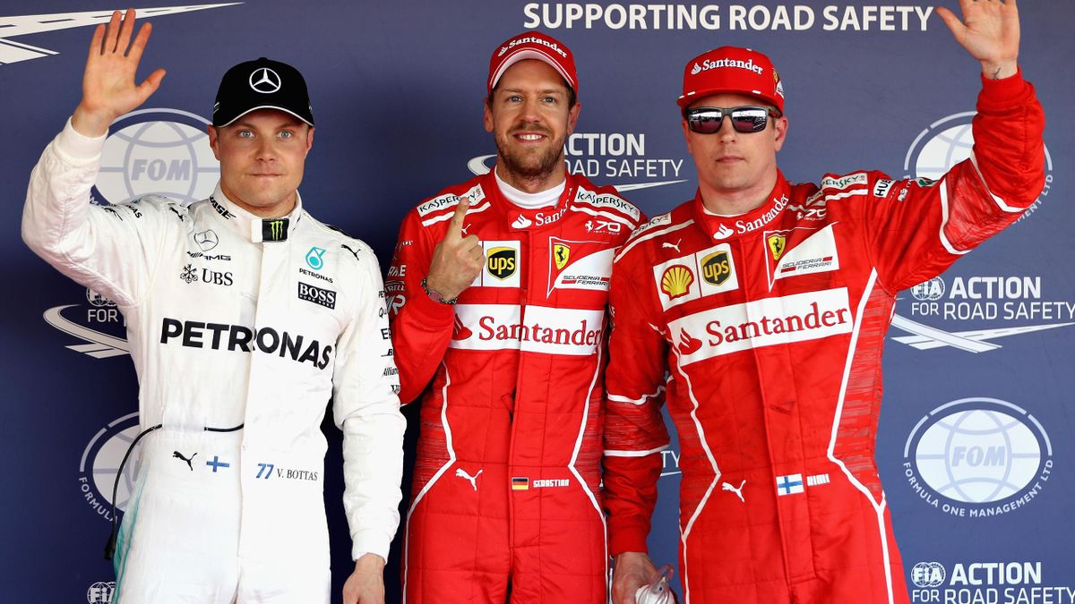 Top three qualifiers, Sebastian Vettel of Germany and Ferrari, Kimi Raikkonen of Finland and Ferrari and Valtteri Bottas of Finland and Mercedes GP