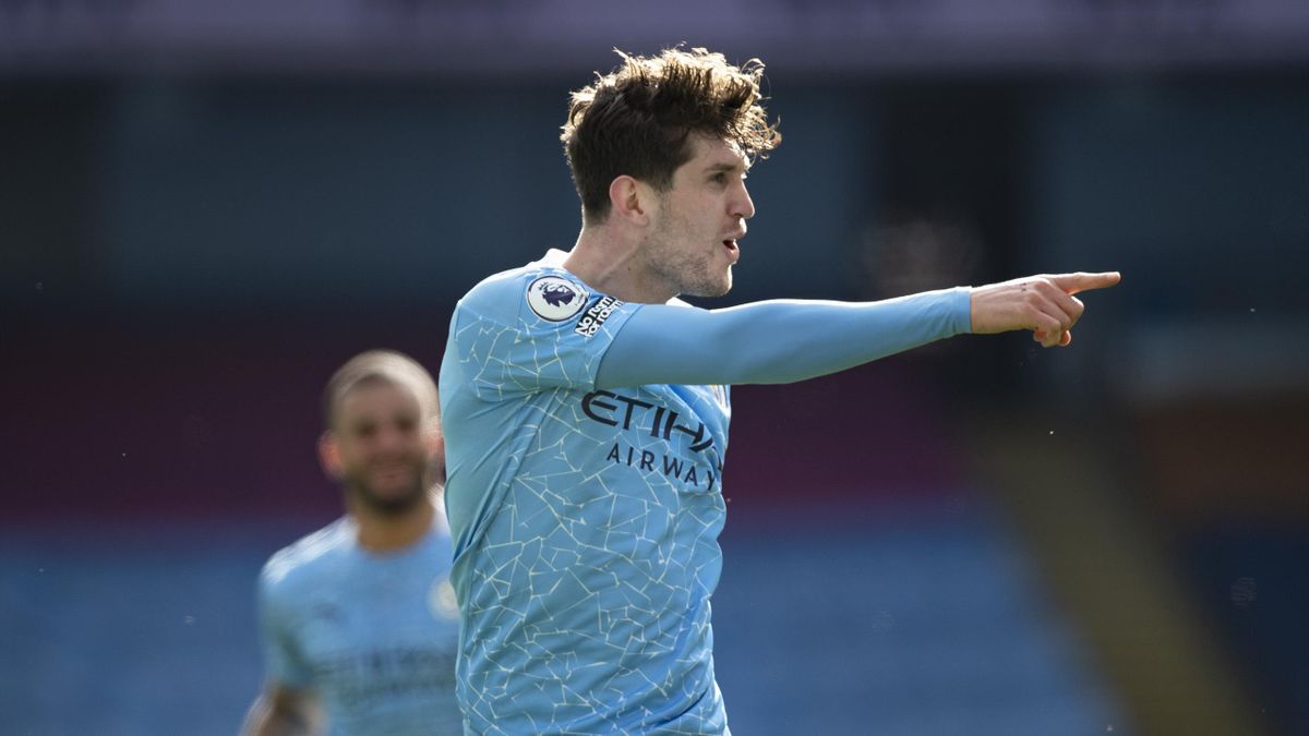 John Stones of Manchester City celebrates scoring the second goal during the Premier League match between Manchester City and West Ham United at Etihad Stadium on February 27, 2021 in Manchester, United Kingdom