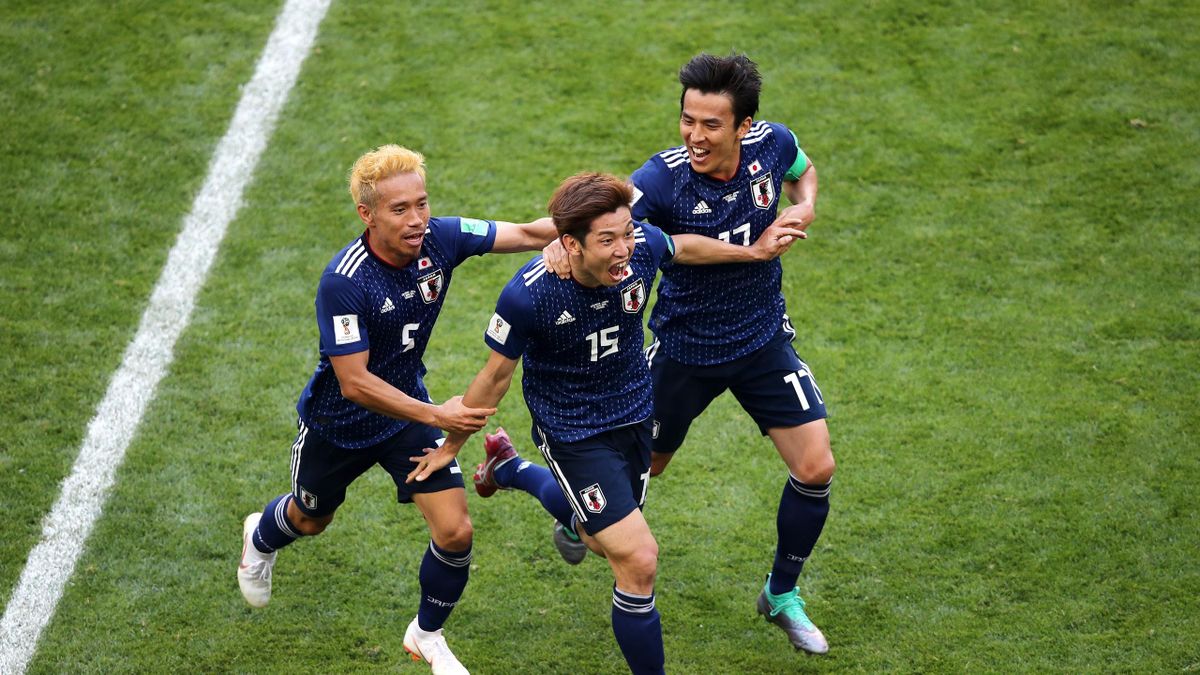 Yuya Osako of Japan celebrates scoring the 2nd Japan goal to make it 2-1 with Yuto Nagatomo and Makoto Hasebe of Japan during the 2018 FIFA World Cup Russia group H match between Colombia and Japan at Mordovia Arena on June 19, 2018 in Saransk, Russia.