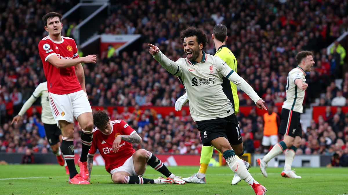 Mohamed Salah of Liverpool celebrates scoring his teams third goal during the Premier League match between Manchester United and Liverpool at Old Trafford