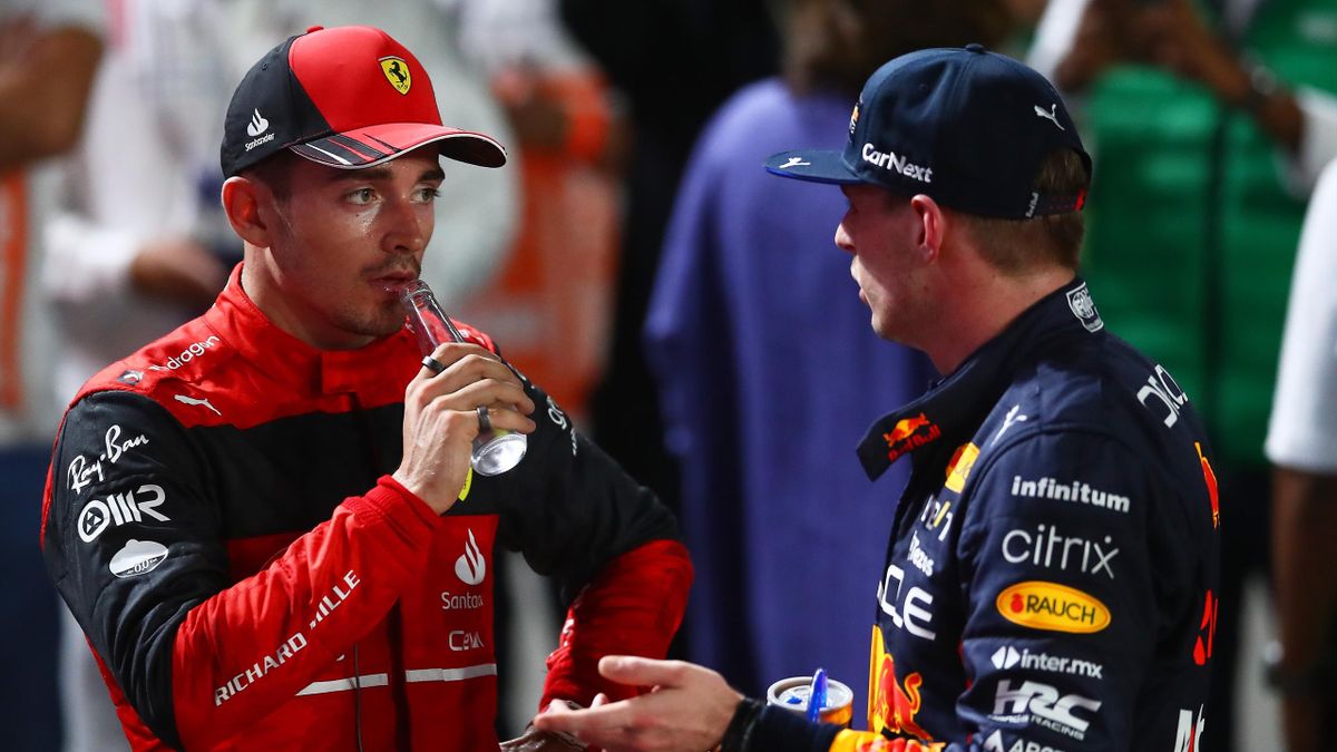 Max Verstappen of the Netherlands driving the (1) Oracle Red Bull Racing RB18 Honda and Charles Leclerc of Monaco driving (16) the Ferrari F1-75 speak