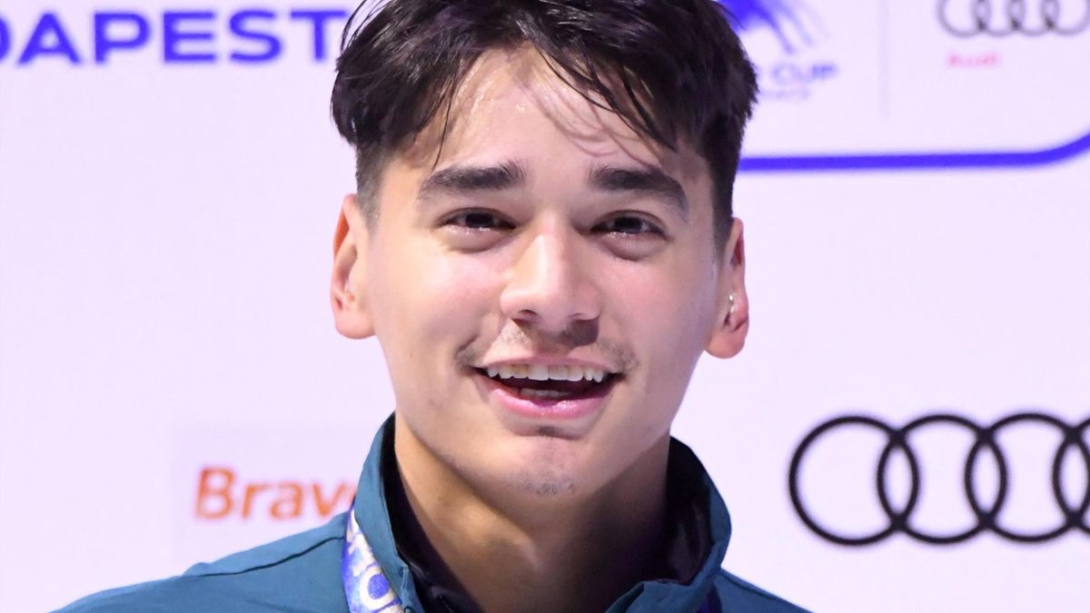 Gold medalist Hungary's Shaolin Sandor Liu celebrates on the podium after the final of the Men's 500m race during the ISU Short Track Speed Skating World Cup at the BOK Hall in Budapest on September 30, 2017 during their Olympic qualification event.