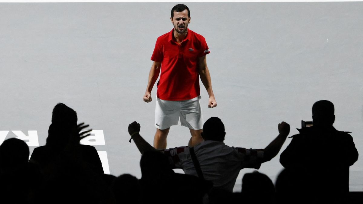 Croatia's Mate Pavic celebrates beating Serbia's Novak Djokovic and Serbia's Filip Krajinovic during the men's doubles semi-final tennis match between Croatia and Serbia of the Davis Cup tennis tournament at the Madrid arena in Madrid on December 3, 2021