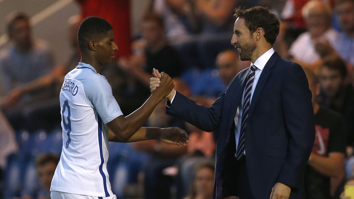 England's Marcus Rashford with England under 21 manager Gareth Southgate after he is substituted