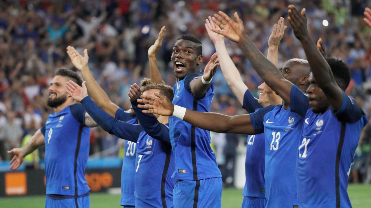 France's Paul Pogba celebrates with team mates at the end of the match