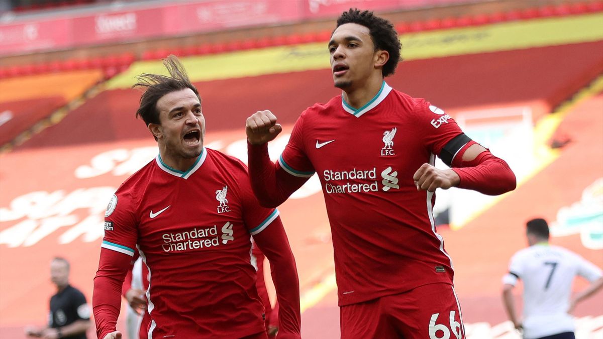 Liverpool's English defender Trent Alexander-Arnold (R) celebrates scoring his team's second goal during the English Premier League football match between Liverpool and Aston Villa at Anfield in Liverpool, north west England on April 10, 2021.