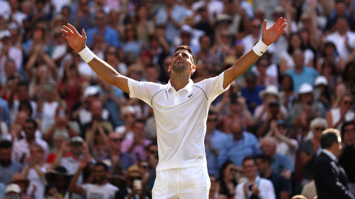 Novak Djokovic of Serbia celebrates winning match point against Nick Kyrgios of Australia during their Men's Singles Final match on day fourteen of The Championships Wimbledon 2022