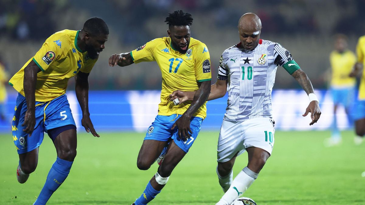 Ghana's forward Andre Ayew (R) fights for the ball with Gabon's midfielder Andre Biyogo Poko (C) during the Group C Africa Cup of Nations (CAN) 2021 football match between Gabon and Ghana at Stade Ahmadou Ahidjo in Yaounde on January 14, 2022.