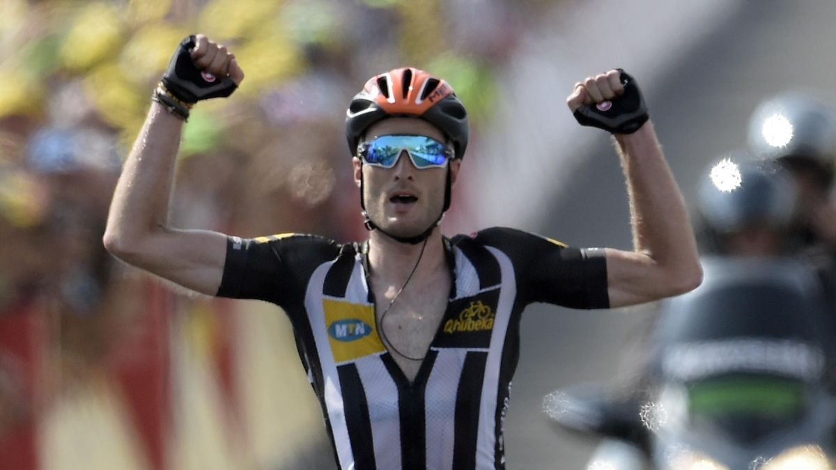 Great Britain's Stephen Cummings celebrates as he crosses the finish line at the end of the 178,5 km fourteenth stage of the 102nd edition of the Tour de France cycling race on July 18, 2015, between Rodez and Mende, southern France