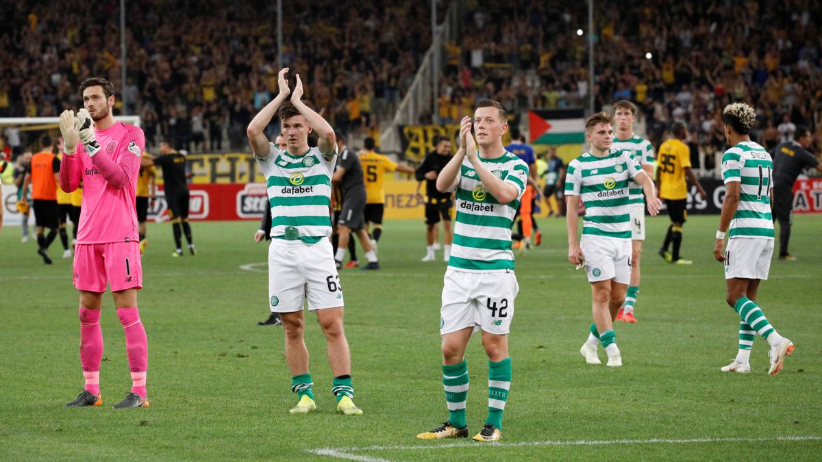 Celtic's Callum McGregor and team mates applaud fans after the match