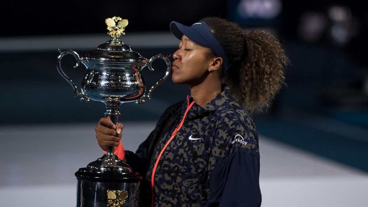 Naomi Osaka of Japan celebrates with the Trophy after defeating Jennifer Brady of the United States in the women's singles final, during day 13 of the 2021 Australian Open at Melbourne Park on February 20, 2021 in Melbourne, Australia