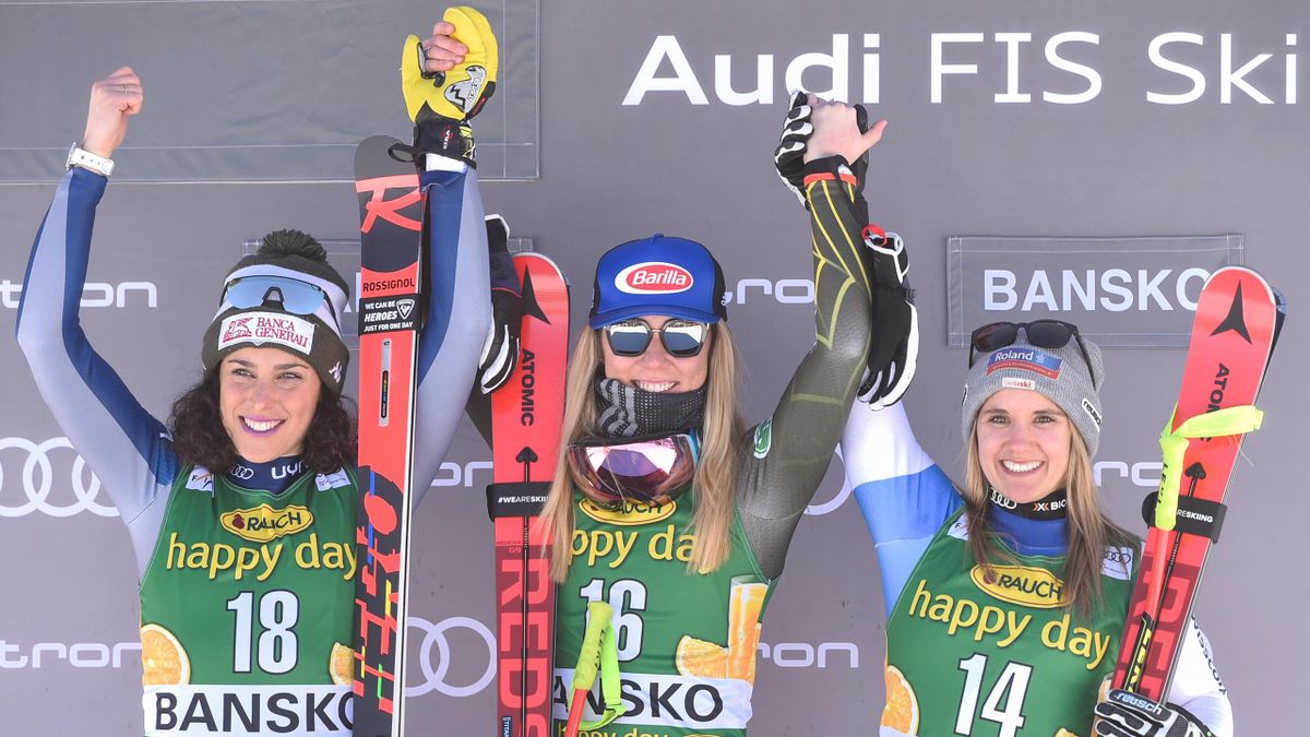 First placed Mikaela Shiffrin of USA (C), Second placed Frederica Brignone of Italy (L) and third placed Joana Haehlen of Switzerland celebrate on the podium after the ladie's downhill event at the FIS ski alpine World Cup in Bansko, on January 24, 2020.