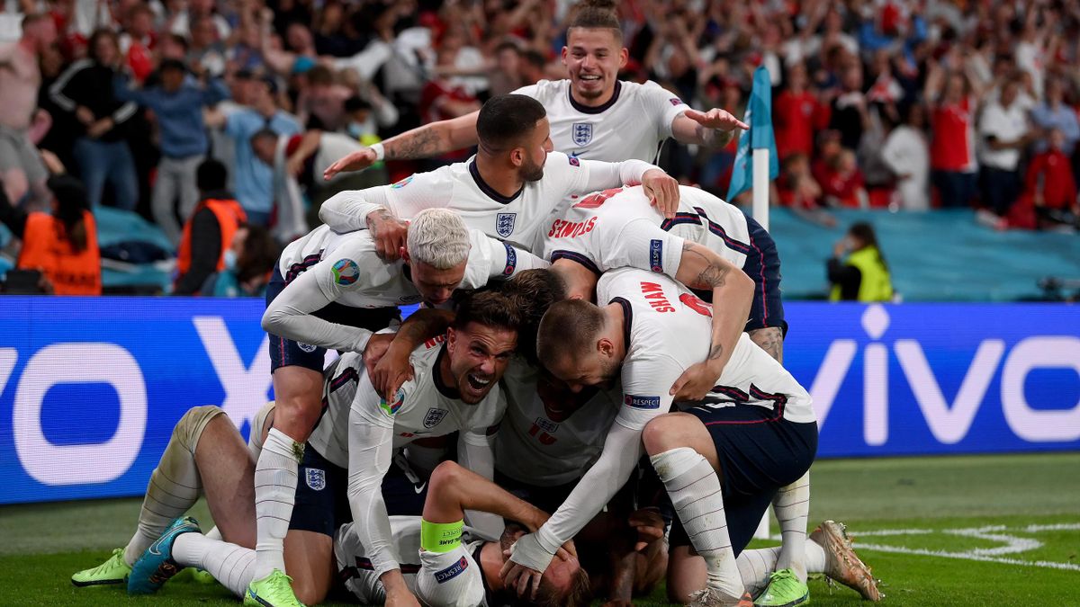 LONDON, ENGLAND - JULY 07: Harry Kane of England (obscured) celebrates with team mates after scoring their side's second goal during the UEFA Euro 2020 Championship Semi-final match between England and Denmark at Wembley Stadium on July 07, 2021 in London