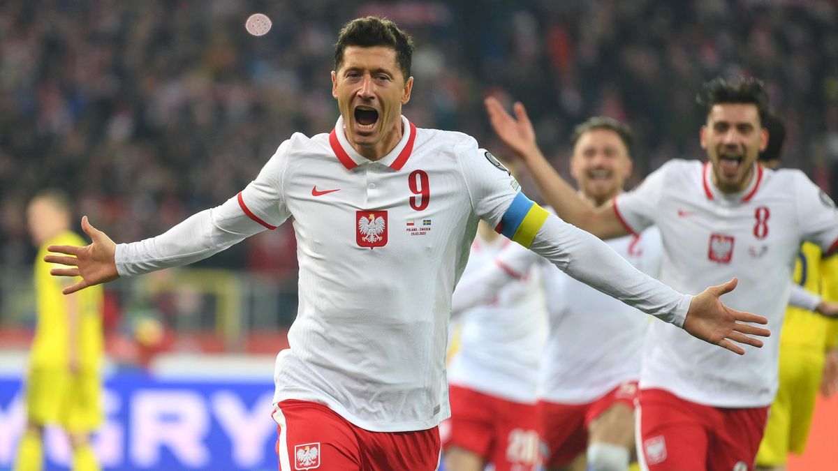 Robert Lewandowski of Poland celebrates after scoring their team's first goal from the penalty spot during the 2022 FIFA World Cup Qualifier knockout round play-off match between Poland and Sweden