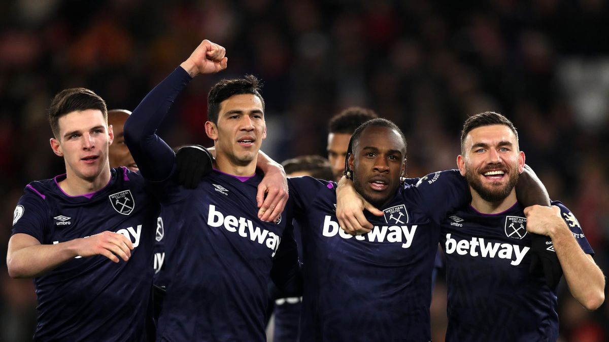 Michail Antonio of West Ham United celebrates with teammates Declan Rice, Fabian Balbuena and Robert Snodgrass of West Ham United after scoring his team's second goal, which is later ruled out by VAR during the Premier League match between Southampton FC