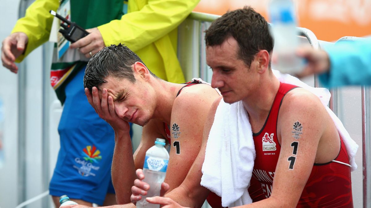 Jonathan Brownlee of England (1) and Alistair Brownlee of England (11) look dejected after the Men's Triathlon on day one of the Gold Coast 2018 Commonwealth Games at Southport Broadwater Parklands