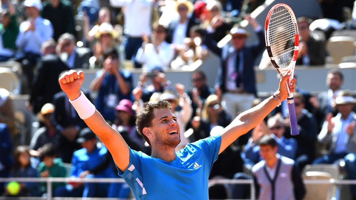 Dominic Thiem of Austria celebrates at match point during his mens singles semi-final match against Novak Djokovic of Serbia during Day fourteen of the 2019 French Open at Roland Garros on June 08, 2019 in Paris, France.