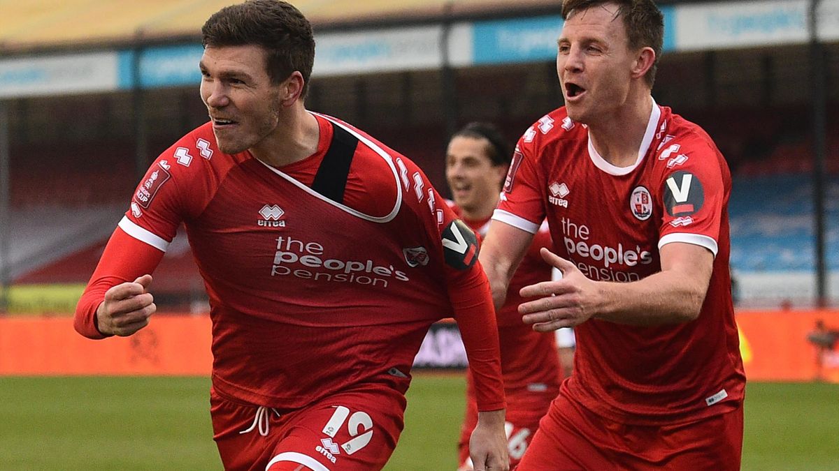 Crawley Town's English defender Jordan Tunnicliffe (L) celebrates after scoring their third goal during the English FA Cup third round football match between Crawley Town and Leeds United at Broadfield Stadium in Crawley