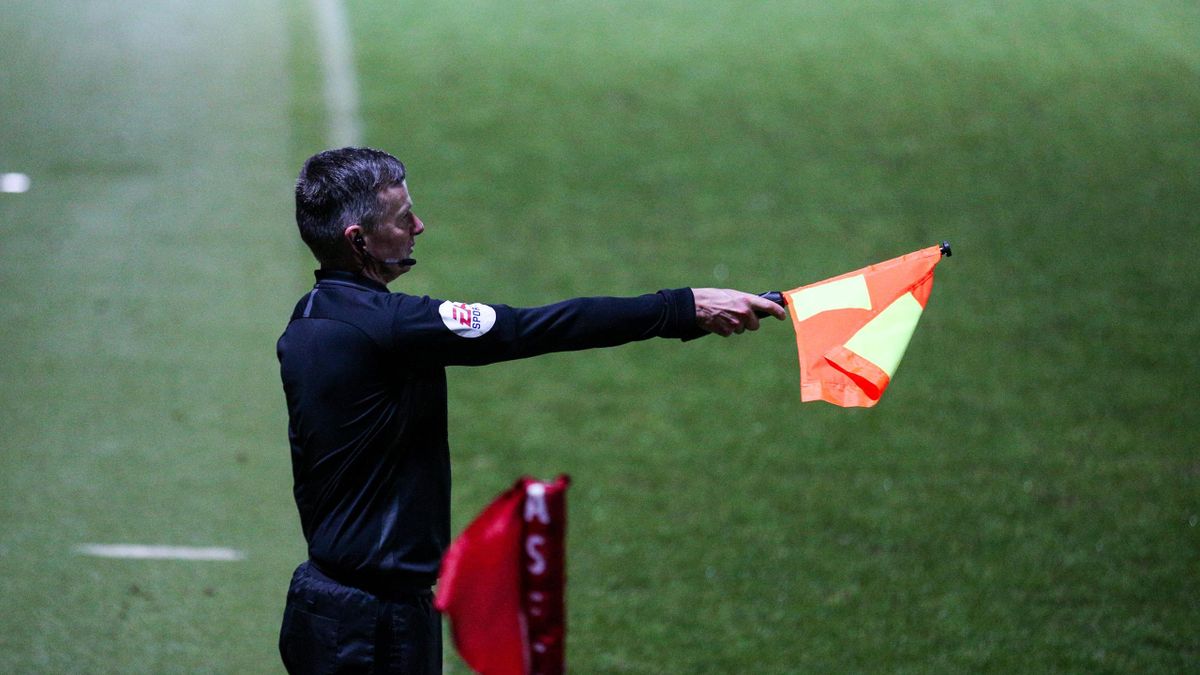 Assistant referee Paul Graham raises his flag as the goal scored by Hull City's Josh Magennis is ruled out for offside during the Sky Bet League One match between Accrington Stanley and Hull City at The Crown Ground on January 26, 2021 in Accrington, Engl