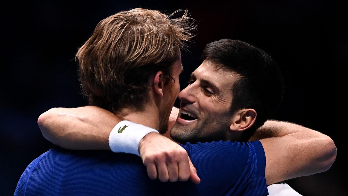 Germany's Alexander Zverev, left, and Serbia's Novak Djokovic hug after the singles semifinal tennis match of the ATP Finals, at the Pala Alpitour venue in Turin, Italy.