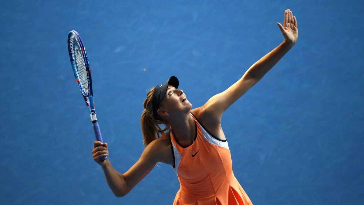 Russia's Maria Sharapova serves during her first round match against Japan's Nao Hibino