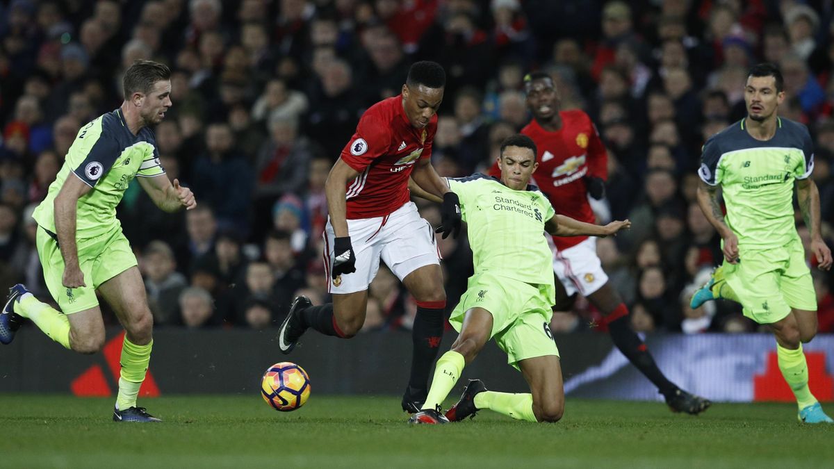 Manchester United's Anthony Martial in action with Liverpool's Trent Alexander-Arnold