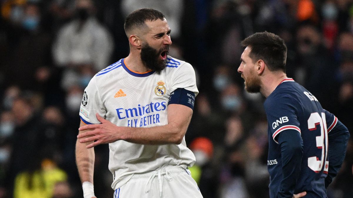 Real Madrid's French forward Karim Benzema (L) reacts next to Paris Saint-Germain's Argentinian forward Lionel Messi