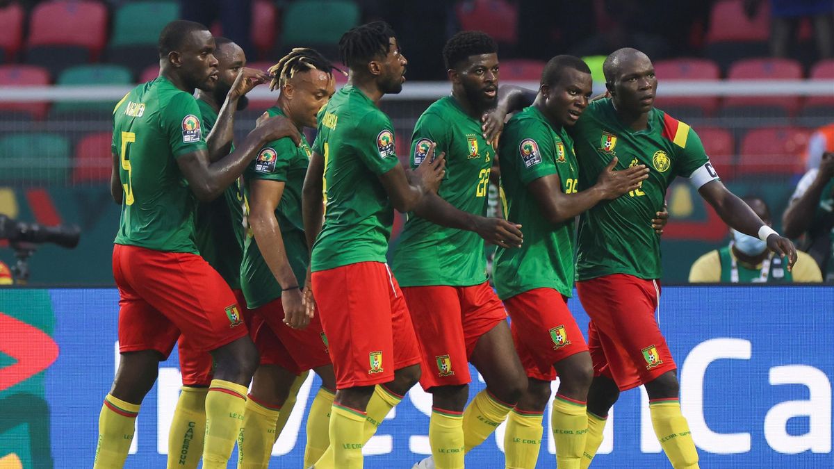 Cameroon's forward Vincent Aboubakar (R) celebrate with teammates after scoring his team's second goal during the Group A Africa Cup of Nations (CAN) 2021 football match between Cameroon and Burkina Faso at Stade d'Olembé in Yaounde on January 9, 2022
