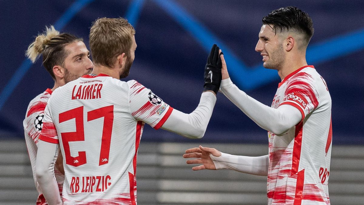 Dominik Szoboszlai celebrates with team-mates after scoring his team's first goal during the UEFA Champions League group A match between RB Leipzig and Manchester City