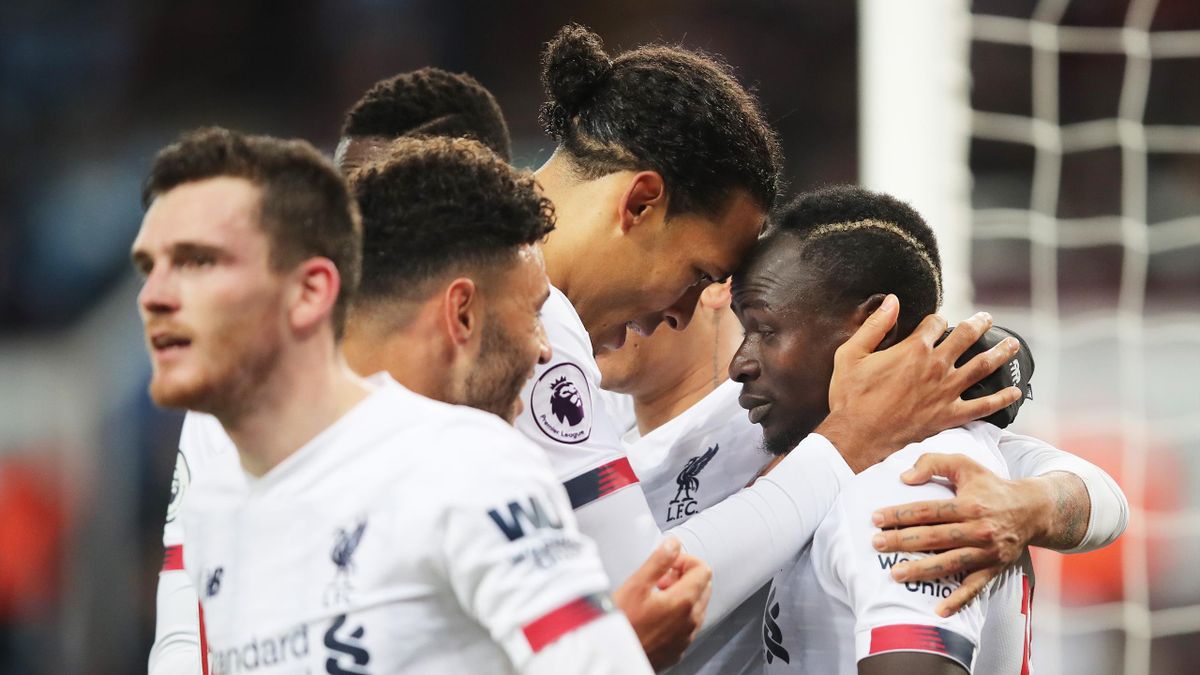 Sadio Mane of Liverpool celebrates with teammate Virgil van Dijk after scoring his team's second goal during the Premier League match between Aston Villa and Liverpool FC at Villa Park on November 02, 2019 in Birmingham, United Kingdom.