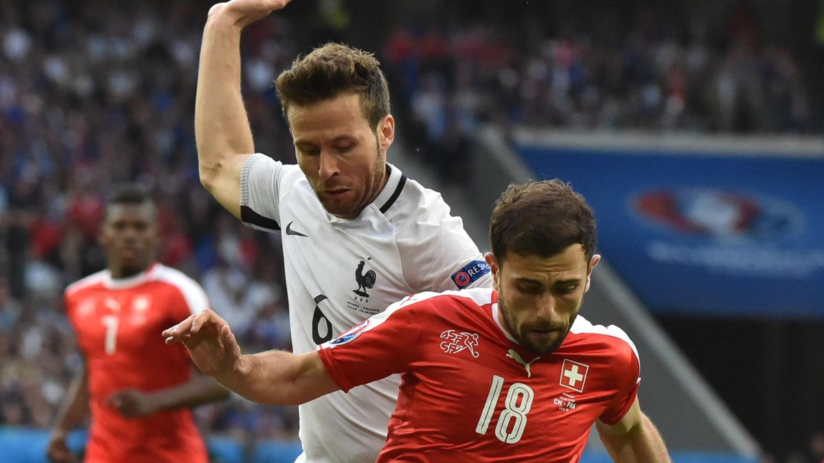 France's midfielder Yohan Cabaye (L) vies for the ball with Switzerland's forward Admir Mehmedi during the Euro 2016 group A football match between Switzerland and France at the Pierre-Mauroy stadium in Lille on June 19, 2016