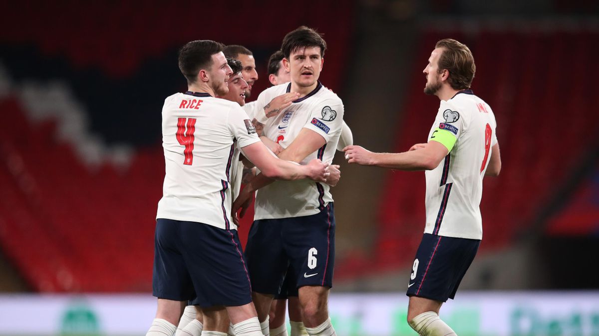 Harry Maguire of England celebrates with Declan Rice and Harry Kane after scoring their side's second goal during the FIFA World Cup 2022 Qatar qualifying match between England and Poland on March 31, 2021 at Wembley Stadium