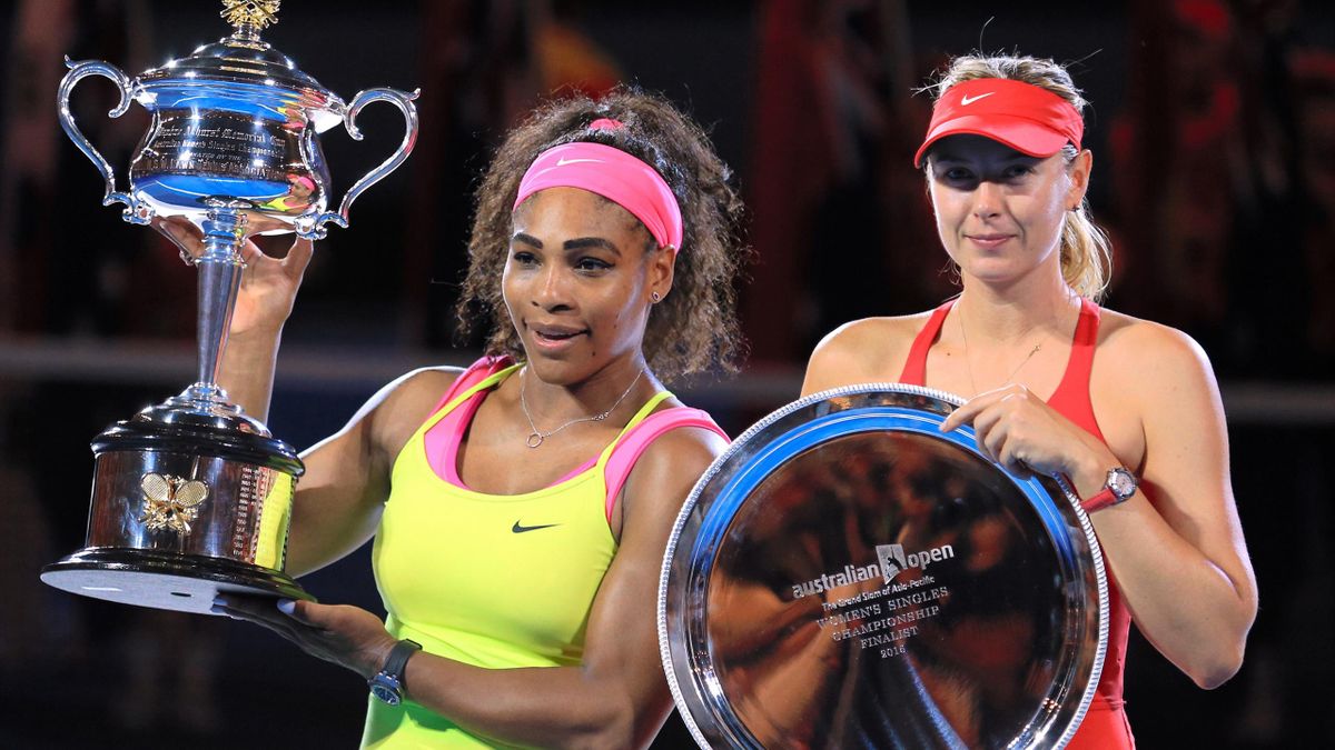 Serena Williams of the United States holds the Daphne Akhurst Memorial Cup and Maria Sharapova of Russia holds the runner up plate after their women's final match