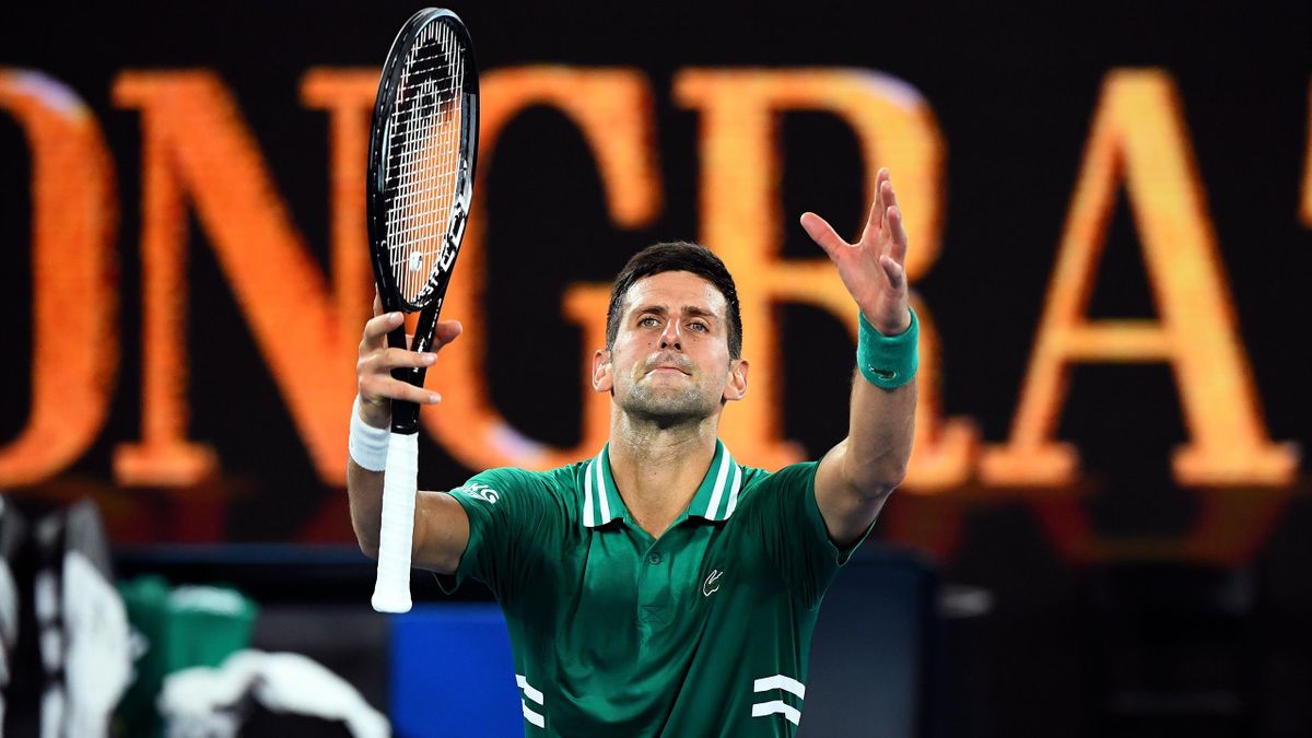 Serbia's Novak Djokovic celebrates after winning against Germany's Alexander Zverev during their men's singles quarter-final match on day nine of the Australian Open tennis tournament in Melbourne