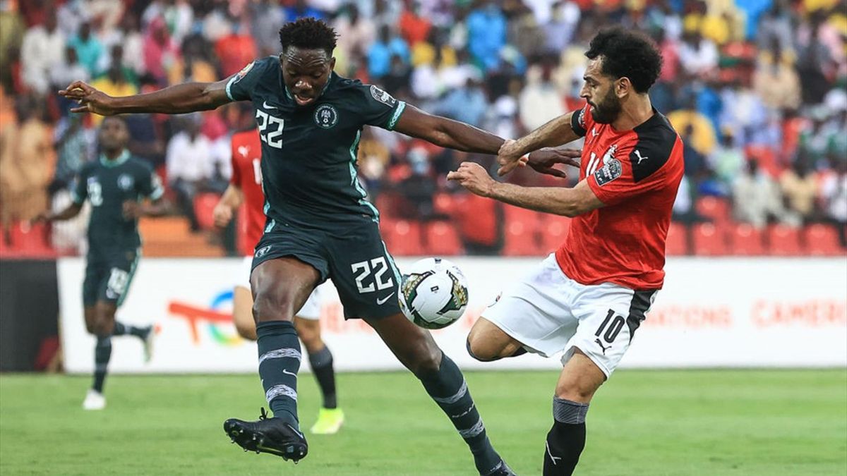 Egypt's forward Mohamed Salah (R) fights for the ball with Nigeria's defender Kenneth Omeruo during the Group D Africa Cup of Nations (CAN) 2021 football match between Nigeria and Egypt at Stade Roumde Adjia in Garoua on January 11, 2022