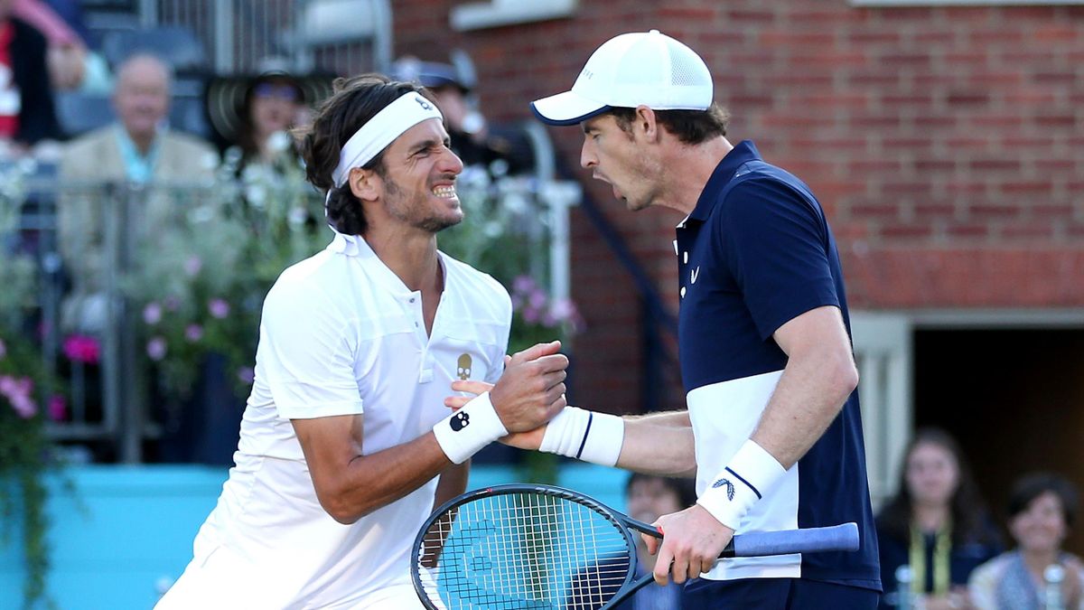 Andy Murray of Great Britain and partner Feliciano Lopez of Spain celebrate a break during the mens doubles semi-final match against Henri Kontinen of Finland John Peers of Australia during day six of the Fever-Tree Championships at Queens Club on June 22