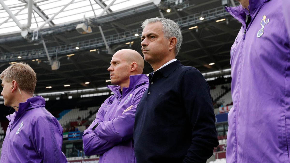 Tottenham Hotspur's Portuguese head coach Jose Mourinho (C) watches the players warm up before the start of the English Premier League football match between West Ham United and Tottenham Hotspur at The London Stadium, in east London on November 23, 2019