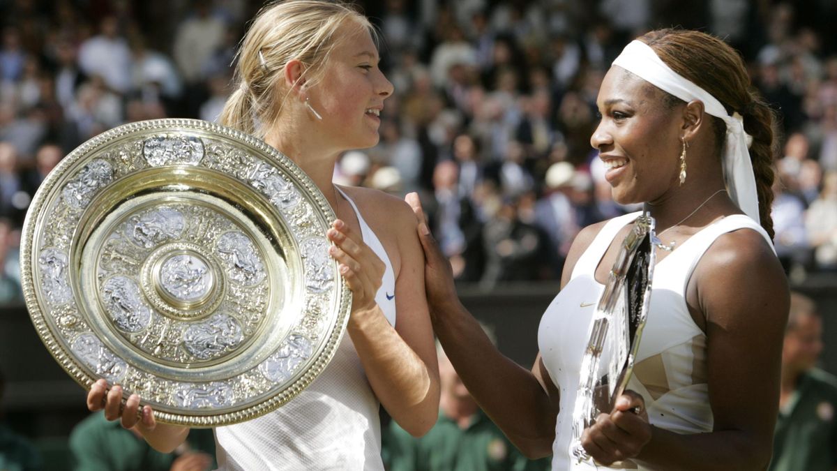 Maria Sharapova (L) of Russia and Serena Williams of the U.S. hold their respective trophies after their women's final match at the Wimbledon Tennis Championships in London, July 3, 2004. Seventeen-year-old Sharapova won the match.